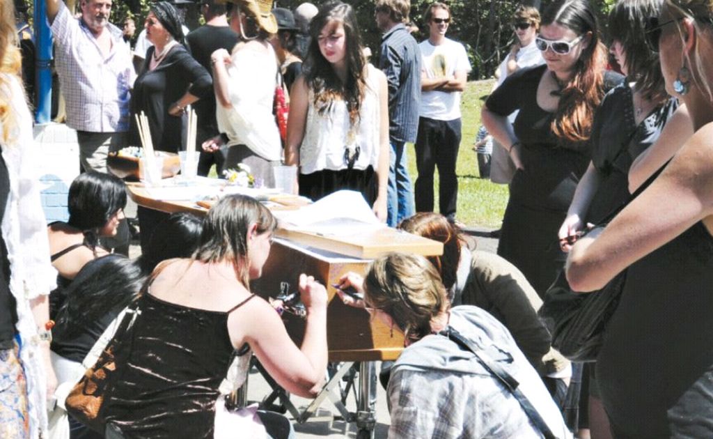 Friends and family leave their messages on the coffin of Jarah Blackett at this funeral service. Friends and family leave their messages on the coffin of Jarah Blackett at this funeral service.