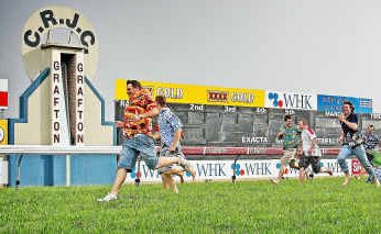 They're racing: Scott Kenny crosses the line ahead of his competitors in a race of a different kind at Grafton Racecourse. They're racing: Scott Kenny crosses the line ahead of his competitors in a race of a different kind at Grafton Racecourse.