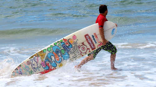Ruben Roxburgh heads out for some action in the open 9-foot division of the Evans Head Longboard Invitational last year. Ruben Roxburgh heads out for some action in the open 9-foot division of the Evans Head Longboard Invitational last year.