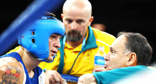 Damien Hooper listens to advice from his corner during a bout against Juan Carlos Carrillo of Colombia. Damien Hooper listens to advice from his corner during a bout against Juan Carlos Carrillo of Colombia.