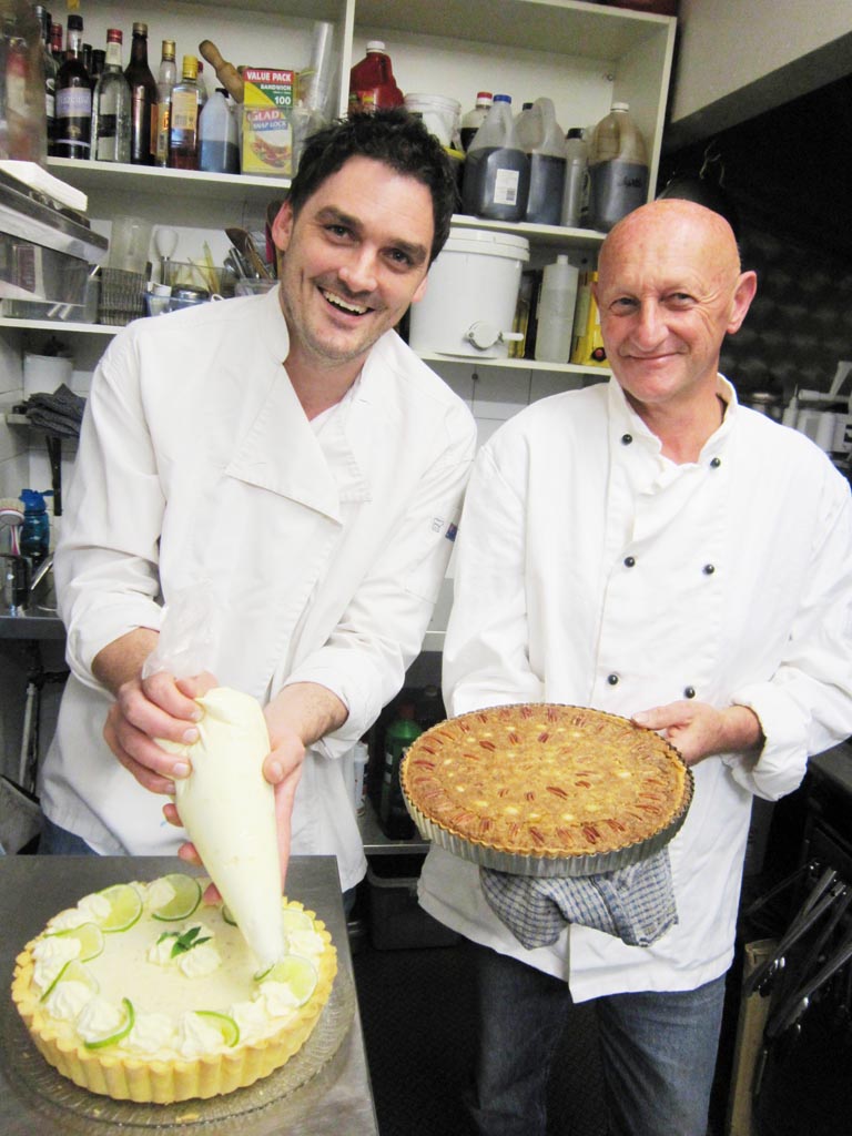 Getting into the bake-off spirit are judges Matt Mayall and Manfred Rudolf. Getting into the bake-off spirit are judges Matt Mayall and Manfred Rudolf.