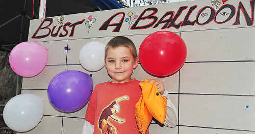 Noah Fischer-Cahill had fun with the Bust a Balloon game at Petrie Park’s 16th annual Raft Race and Festival on Saturday afternoon. Noah Fischer-Cahill had fun with the Bust a Balloon game at Petrie Park’s 16th annual Raft Race and Festival on Saturday afternoon.