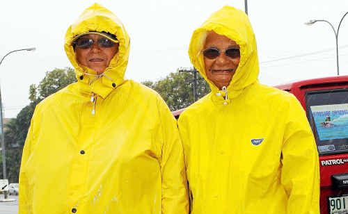Judith and Myrtle Singho were well prepared for an outing in yesterday’s bad weather. Judith and Myrtle Singho were well prepared for an outing in yesterday’s bad weather.