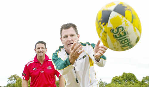 Peter Slattery gives some passing advice to ex-Wallaby Michael O'connor in the countdown to the big rugby sevens tournament in Noosa. Peter Slattery gives some passing advice to ex-Wallaby Michael O'connor in the countdown to the big rugby sevens tournament in Noosa.