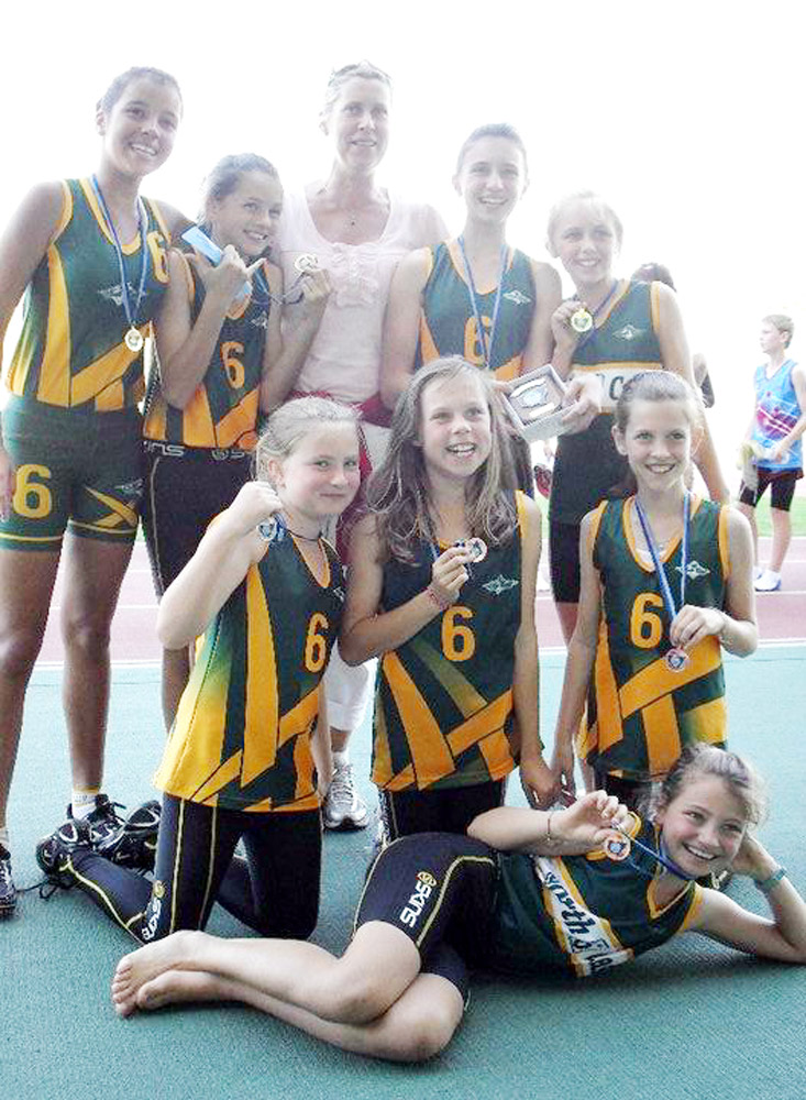Members of the two medal-winning Byron Bay relay teams with coach Heather Farquhar. Members of the two medal-winning Byron Bay relay teams with coach Heather Farquhar.