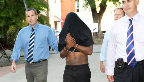 The man charged over attack is escorted by detectives to an earlier court hearing. The man charged over attack is escorted by detectives to an earlier court hearing.