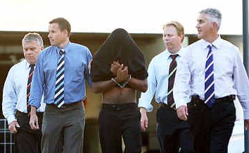 David Samuel Aubrey Ray (pictured with face covered) will face trial for the rape and murder of a Rockhampton grandmother. David Samuel Aubrey Ray (pictured with face covered) will face trial for the rape and murder of a Rockhampton grandmother.