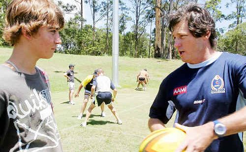 Top tips: Tournament director Bill Harrigan hands out tips on playing Oztag to a young fan. Top tips: Tournament director Bill Harrigan hands out tips on playing Oztag to a young fan.