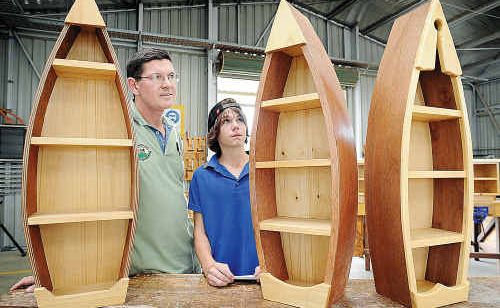 Furnishing teacher Neil Murray (above) shows Leam Flegler, 14, some of the students’ work at the Glendyne Education and Training Centre open day. Furnishing teacher Neil Murray (above) shows Leam Flegler, 14, some of the students’ work at the Glendyne Education and Training Centre open day.