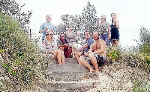 WOOLI residents share a drink in the dunes. Roger Goldsmith is pictured back left. WOOLI residents share a drink in the dunes. Roger Goldsmith is pictured back left.