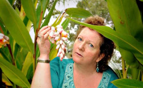 Susan Cook with some Ornamental Ginger growing in a Jones Hill garden. Susan Cook with some Ornamental Ginger growing in a Jones Hill garden.
