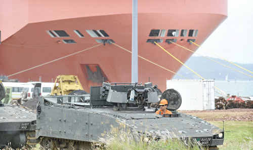 A carrier in Gladstone Port loading Army machinery. A carrier in Gladstone Port loading Army machinery.