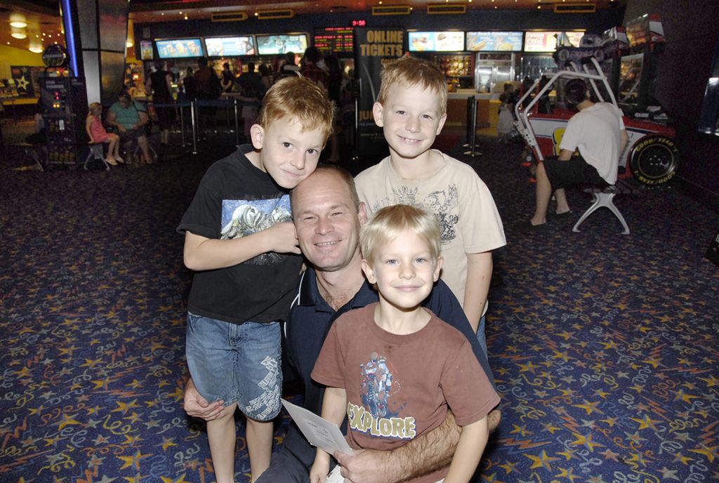 Snow Green with his sons Nathan (left) Craig (right) and Andrew (front) at the movie premier of "Tangled" at Grand Central Cinemas.