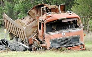 Rogue wheels: Mr Henson’s stubborn old gravel truck finally came to a rest in a paddock on Saturday after an unmanned 750-metre journey towards Summerland Way on Saturday. Rogue wheels: Mr Henson’s stubborn old gravel truck finally came to a rest in a paddock on Saturday after an unmanned 750-metre journey towards Summerland Way on Saturday.