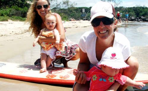 Jess Nock with Leila (6 months) and Surfing Mums Brunswick Heads co-ordinator Emma Waters with Mali (6 months) at Torakina Beach. Jess Nock with Leila (6 months) and Surfing Mums Brunswick Heads co-ordinator Emma Waters with Mali (6 months) at Torakina Beach.