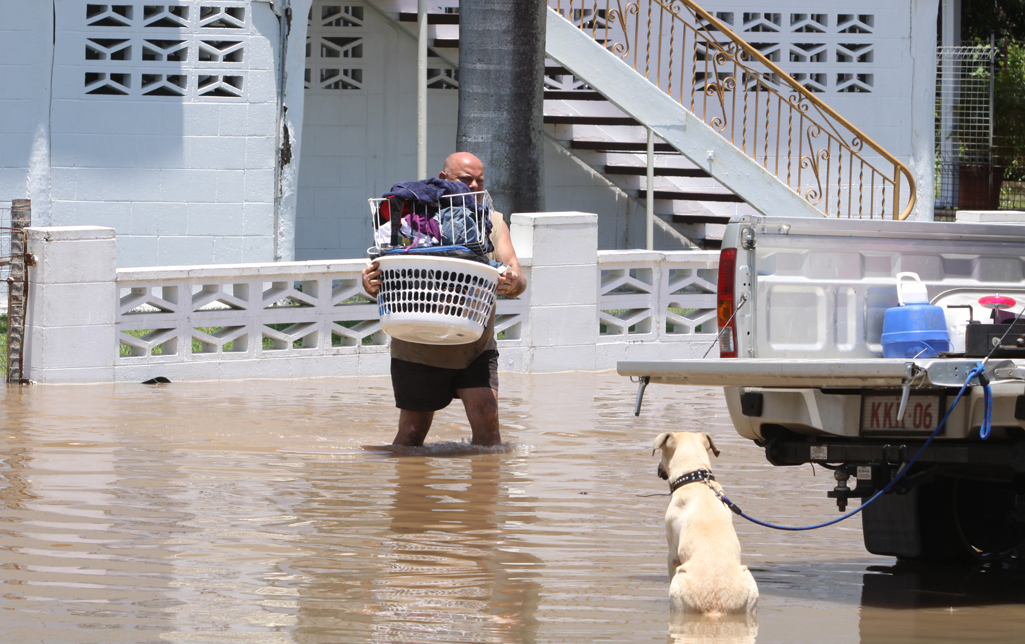 A man packs his belongings into the back of a ute during the floods in Rockhampton. A man packs his belongings into the back of a ute during the floods in Rockhampton.