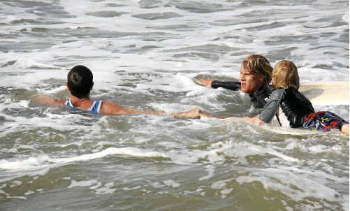 Off-duty lifeguards Damian McDermid and Nick Fraser rescue a young boy caught in a rip at Yamba’s Main Beach. Off-duty lifeguards Damian McDermid and Nick Fraser rescue a young boy caught in a rip at Yamba’s Main Beach.