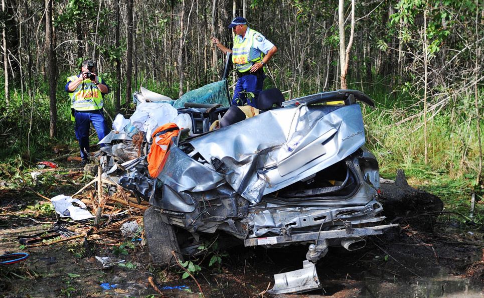 Police examine the wreckage of a fatal crash on the Pacific Highway near Tabbimobile. Photo: ADAM HOURIGAN/The Daily Examiner. Police examine the wreckage of a fatal crash on the Pacific Highway near Tabbimobile. Photo: ADAM HOURIGAN/The Daily Examiner.