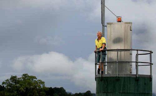 On guard: Wayne Watson checks the gauges at Bray Park weather station. On guard: Wayne Watson checks the gauges at Bray Park weather station.
