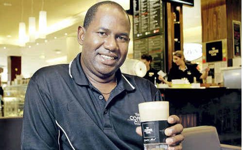 Redbank Plaza Coffee Club franchisee Boubacar Barry will be donating money spent on coffees on Wednesday to the flood victims. Redbank Plaza Coffee Club franchisee Boubacar Barry will be donating money spent on coffees on Wednesday to the flood victims.