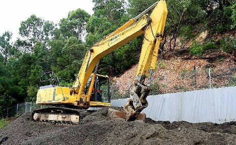 Mess: Work begins on the landslip on Tugun Bypass. Mess: Work begins on the landslip on Tugun Bypass.