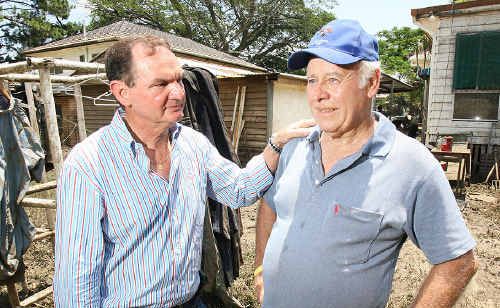 Ipswich Mayor Paul Pisasale consoles Ian Surawski at his wrecked home in Brisbane Terrace, Goodna, following last week’s devastating floods. Ipswich Mayor Paul Pisasale consoles Ian Surawski at his wrecked home in Brisbane Terrace, Goodna, following last week’s devastating floods.
