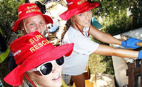 Surf lifesavers Julia O’Brien, Erica Ricketts and Ines Kharoumi clean up in North Booval. Surf lifesavers Julia O’Brien, Erica Ricketts and Ines Kharoumi clean up in North Booval.