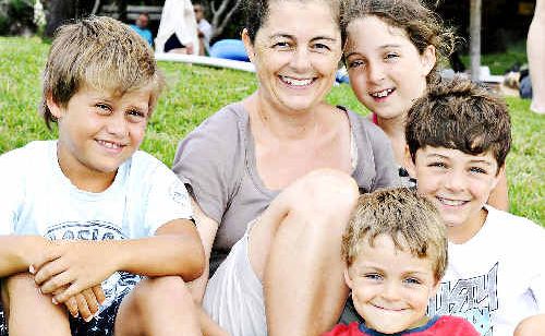 Sarah Robertson with her children Isobel, 10, Alec, 8, and James, 5, and family friend Enrique Grobler, 9 (at left). Ms Robertson found more than $3000 which she collected in her hat. Sarah Robertson with her children Isobel, 10, Alec, 8, and James, 5, and family friend Enrique Grobler, 9 (at left). Ms Robertson found more than $3000 which she collected in her hat.