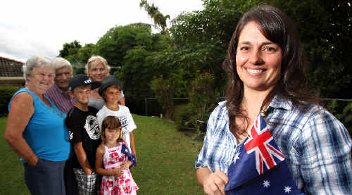 I am Australian: Tammi Elsner celebrates becoming an Australian citizen with family members, from left in background, Lottie Elsner, Katie Elsner, Edmund Elsner, Kaleb Graham, Anita Graham and Nathan Elsner. I am Australian: Tammi Elsner celebrates becoming an Australian citizen with family members, from left in background, Lottie Elsner, Katie Elsner, Edmund Elsner, Kaleb Graham, Anita Graham and Nathan Elsner.