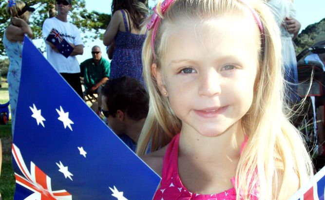 Pictured waving her flags at Brunswick Heads is four-year-old Misty Fahy. Pictured waving her flags at Brunswick Heads is four-year-old Misty Fahy.