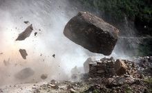 A huge boulder crashes across the mountain road before tumbling to the valley floor beyond. Photo/Brian Walker A huge boulder crashes across the mountain road before tumbling to the valley floor beyond. Photo/Brian Walker