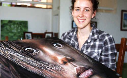 Sienna van Rossum with her latest masterpiece. Sienna van Rossum with her latest masterpiece.