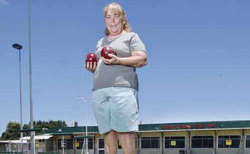 Goodna Bowls Club secretary Cathie Wilmington on the green rescued from sludge. Goodna Bowls Club secretary Cathie Wilmington on the green rescued from sludge.