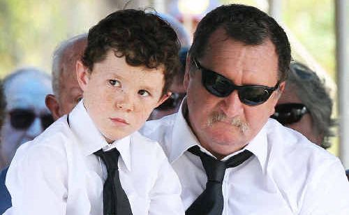 Danny McGuire with his son Zachary Jibson at the funeral yesterday of Llync-Chiann Clark-Jibson, Jocelyn and Garry Jibson. Danny McGuire with his son Zachary Jibson at the funeral yesterday of Llync-Chiann Clark-Jibson, Jocelyn and Garry Jibson.