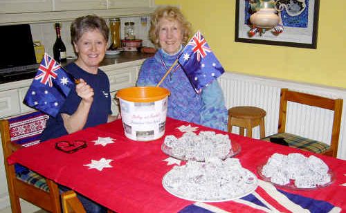England’s Alma Longman and friend Mary Quinton cook up funds for flood victims. England’s Alma Longman and friend Mary Quinton cook up funds for flood victims.