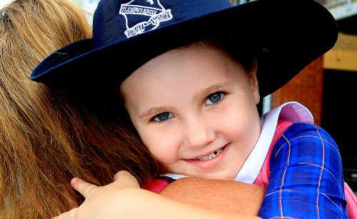 Growing up: Mum Tiffany A’Bell gets a last hug from Aleksia before school. Growing up: Mum Tiffany A’Bell gets a last hug from Aleksia before school.