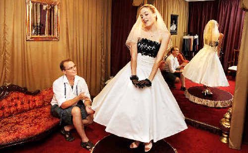 No bridezillas: Lismore Bridal owner Micheal Gates watches store assistant Emily Sexton model the latest 1950s-style new season bridal design. No bridezillas: Lismore Bridal owner Micheal Gates watches store assistant Emily Sexton model the latest 1950s-style new season bridal design.
