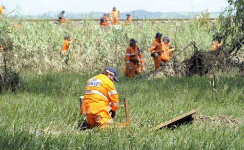 The SES clean up an entry road to the Lockyer Valley township of Grantham. The SES clean up an entry road to the Lockyer Valley township of Grantham.