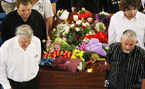 Friends and family surround the casket of Bruce Allan Marshall during his funeral service. Friends and family surround the casket of Bruce Allan Marshall during his funeral service.