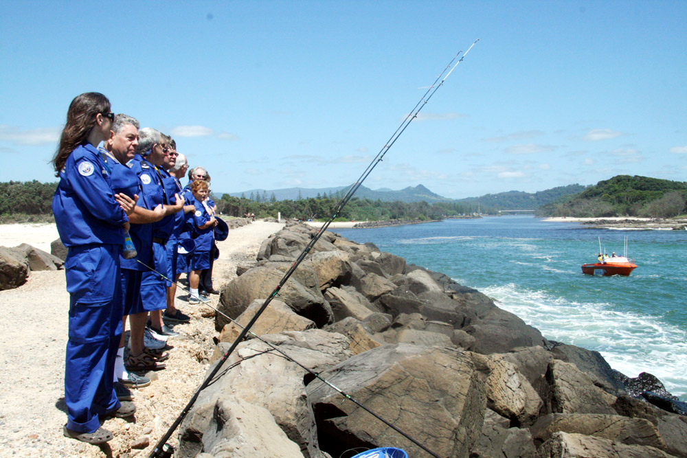 Members of Marine Rescue Brunswick pay their respects to colleague and friend Ed Reid as the rescue boat takes his ashes out to sea. Members of Marine Rescue Brunswick pay their respects to colleague and friend Ed Reid as the rescue boat takes his ashes out to sea.