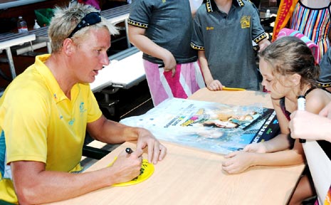 OLYMPIC AND COMMONWEALTH medallist Brenton Rickard signs posters and other memorabilia for adoring fans at Gatton Pool during the Australia Day Carnival last week. OLYMPIC AND COMMONWEALTH medallist Brenton Rickard signs posters and other memorabilia for adoring fans at Gatton Pool during the Australia Day Carnival last week.
