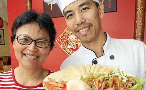 HAPPY NEW YEAR: Patsy Gerver and Kevin Hu, of China Flute Gourmet Restaurant, celebrate with their shredded pork fillets in peking sauce. HAPPY NEW YEAR: Patsy Gerver and Kevin Hu, of China Flute Gourmet Restaurant, celebrate with their shredded pork fillets in peking sauce.