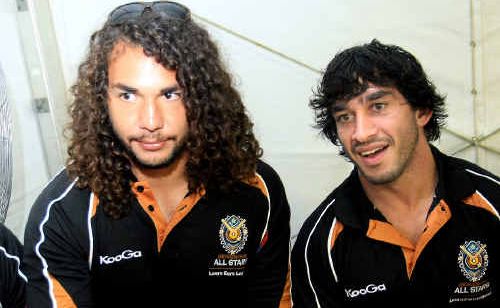 Tweed’s Ryan James (left) signs autographs yesterday with All Stars team-mate Jonathan Thurston. Tweed’s Ryan James (left) signs autographs yesterday with All Stars team-mate Jonathan Thurston.