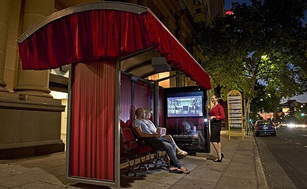 Built as part of the Adelaide Film Festival, this bus shelter movie theatre features authentic theatre seating, cutains and a projector showing screenings every evening. Built as part of the Adelaide Film Festival, this bus shelter movie theatre features authentic theatre seating, cutains and a projector showing screenings every evening.