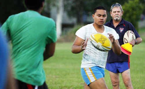 Redbank Plains rugby league club coach Laurie Campbell watches his under-18s at training. Redbank Plains rugby league club coach Laurie Campbell watches his under-18s at training.