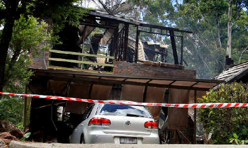 The smouldering remains of the house. The smouldering remains of the house.