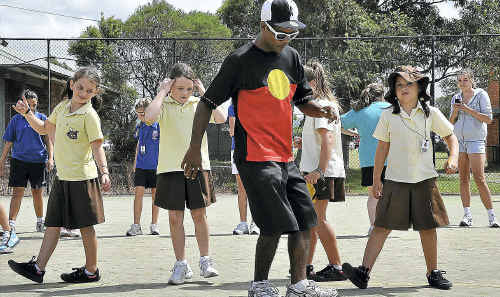 Break dancer Jason Campbell goes through some moves with kids at the Wyong Vibe 3on3. Break dancer Jason Campbell goes through some moves with kids at the Wyong Vibe 3on3.