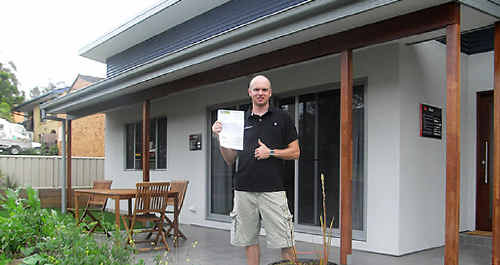 Ben with his latest energy account at Nangara Eco House. Ben with his latest energy account at Nangara Eco House.