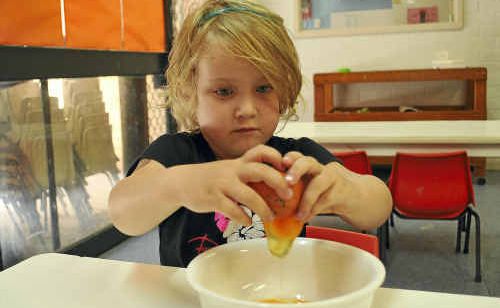 Claire Smith, 4, cracks a fresh egg at Stepping Stones Child Care Centre yesterday. Claire Smith, 4, cracks a fresh egg at Stepping Stones Child Care Centre yesterday.