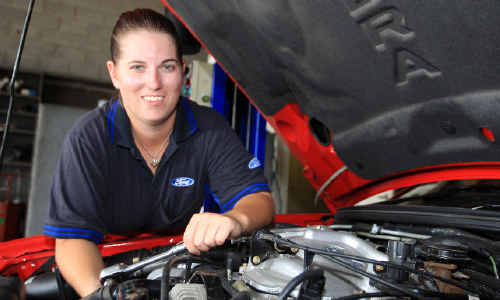 Apprentice mechanic Kristy McAndrew at work on a vehicle at Victory Ford at Murwillumbah. Apprentice mechanic Kristy McAndrew at work on a vehicle at Victory Ford at Murwillumbah.